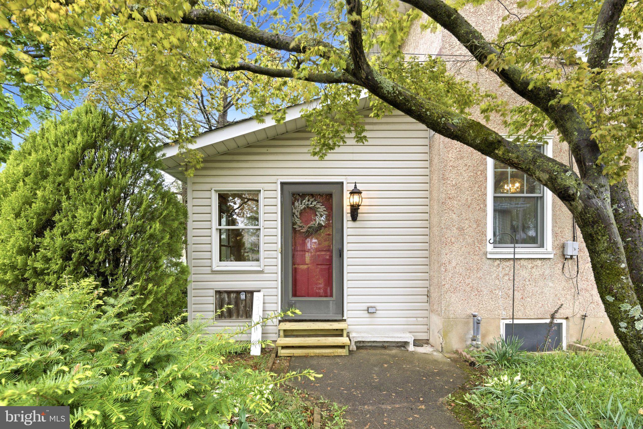 3131 Bedminster Road Ottsville, PA 18942 - Photo 16 of 17 Charming entrance with lush greenery.