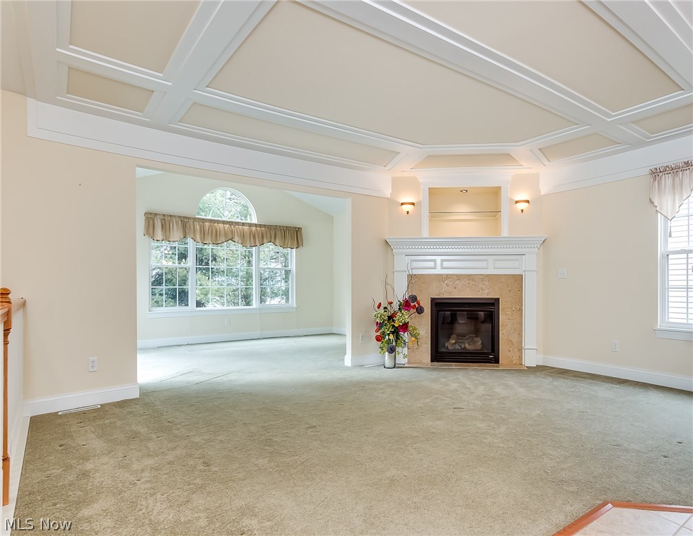 708 Rivers Edge Lane Painesville, OH 44077 - Photo 24 of 24 Popular open floor plan! Beautiful millwork on ceiling in this spacious great room with gas fireplace.