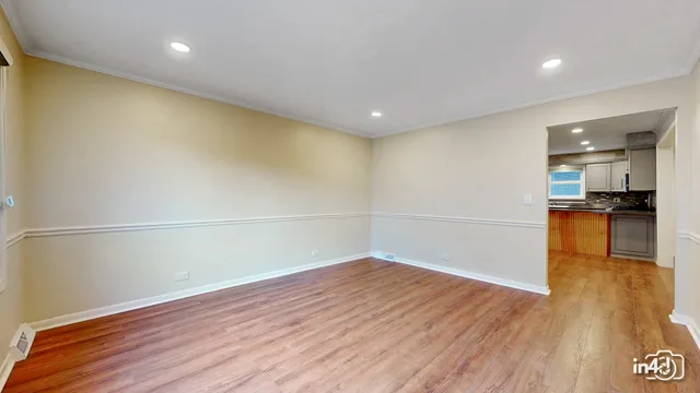 a view of a room with wooden floor