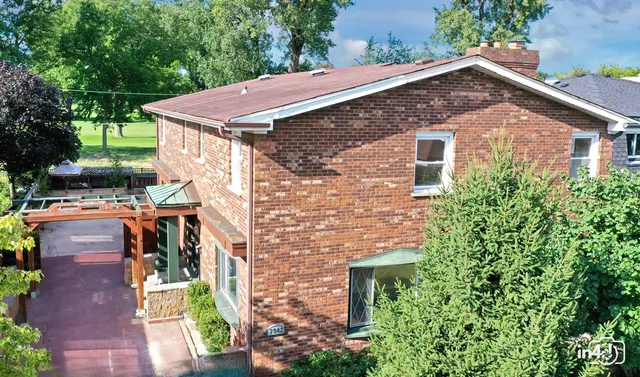 an aerial view of a house with a garden