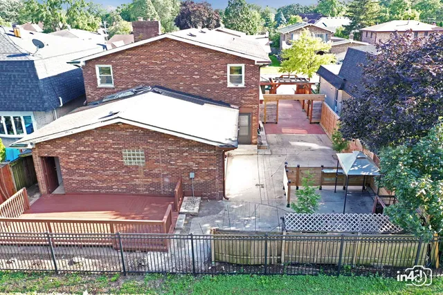 a view of balcony with wooden floor and fence