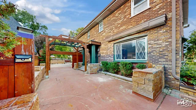 an aerial view of multiple houses with yard