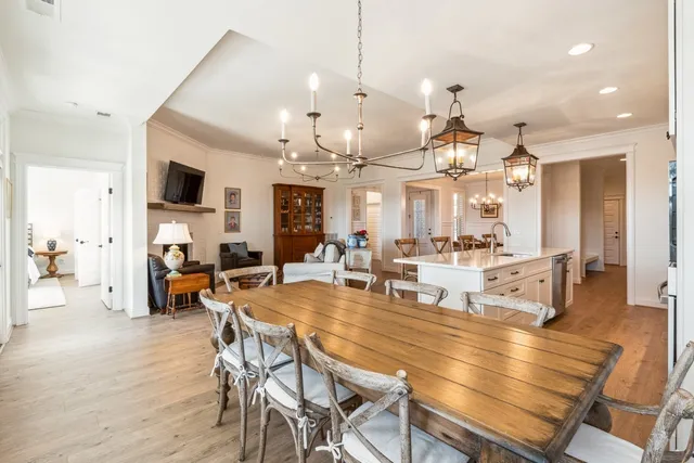 a large kitchen with a table and chairs