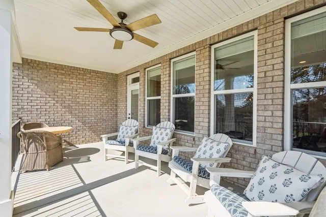 a outdoor space with patio the couches and a dining table with garden view