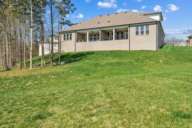 a front view of a house with a yard