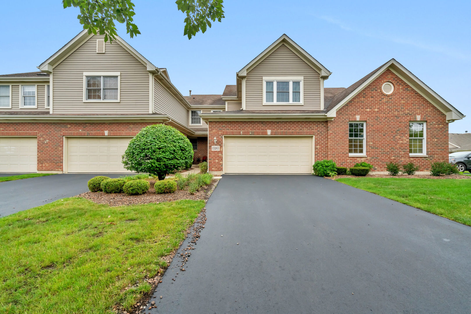 13265 Forest Ridge Drive Palos Heights, IL 60463 - Photo 1 of 12 a front view of a house with a yard and garage