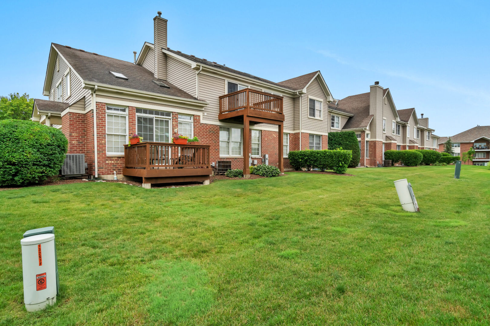 13265 Forest Ridge Drive Palos Heights, IL 60463 - Photo 2 of 12 a front view of a house with a garden and plants