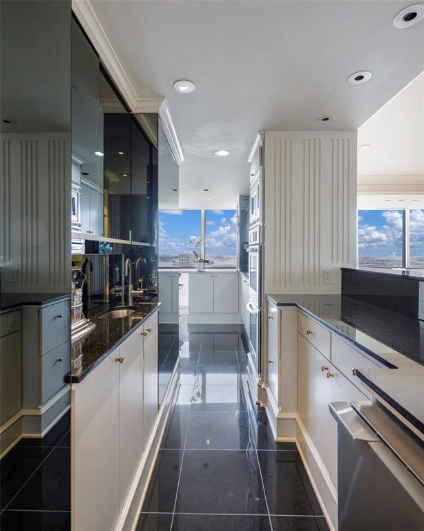 5200 Keller Springs Road, Unit 1534/36 Dallas, TX 75248 - Photo 11 of 35 a kitchen with stainless steel appliances a stove a sink and a refrigerator