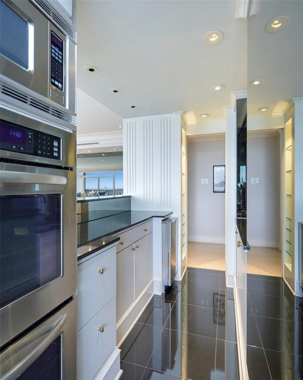 5200 Keller Springs Road, Unit 1534/36 Dallas, TX 75248 - Photo 12 of 35 a kitchen with stainless steel appliances granite countertop a refrigerator and a sink