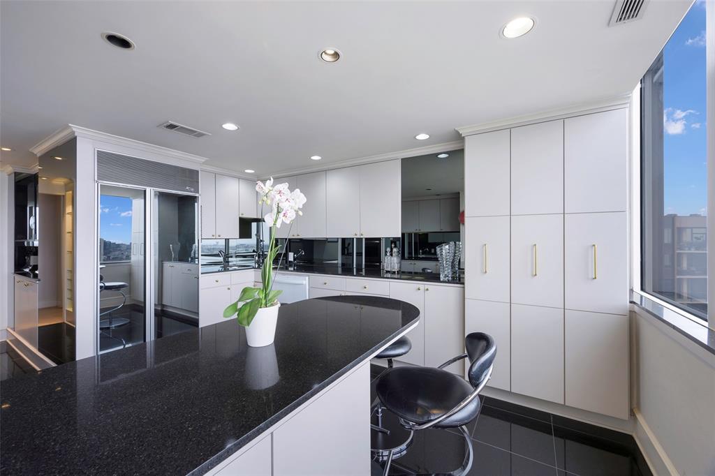 5200 Keller Springs Road, Unit 1534/36 Dallas, TX 75248 - Photo 14 of 35 a kitchen with stainless steel appliances granite countertop a sink refrigerator and cabinets