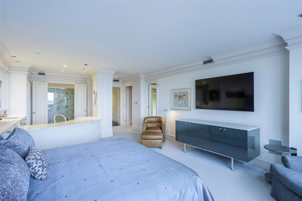 5200 Keller Springs Road, Unit 1534/36 Dallas, TX 75248 - Photo 17 of 35 a bedroom with a bed and tv