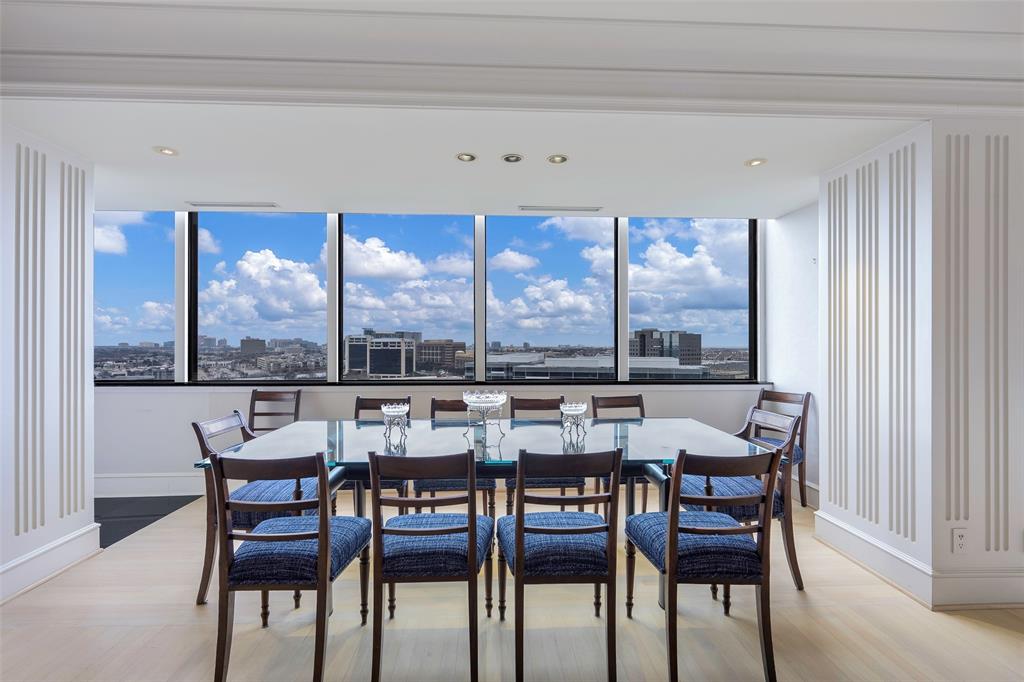 5200 Keller Springs Road, Unit 1534/36 Dallas, TX 75248 - Photo 9 of 35 a view of a dining room with furniture large windows and wooden floor