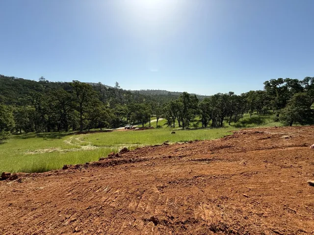 a view of a swimming pool with an outdoor space and seating area
