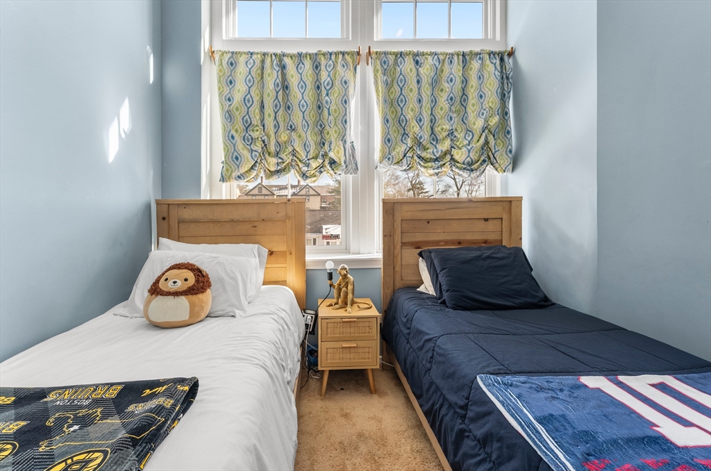 51 Pettee Street, Unit 31 Newton, MA 02464 - Photo 7 of 15 a bedroom with a bed and window