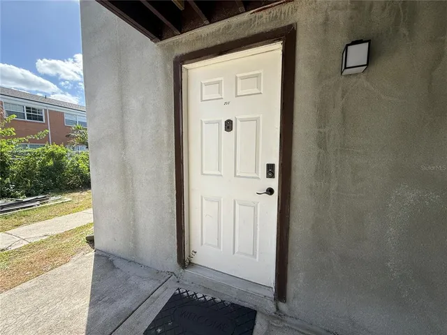 a view of a hallway with a outdoor space