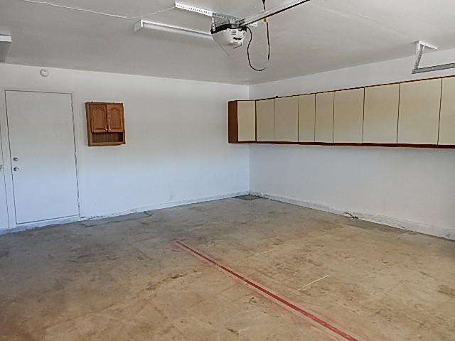 4559 Rolfe Road San Diego, CA 92117 - Photo 13 of 25 2 car garage, ample storage, washer/dryer area/hook ups on left (can't see on this photo)