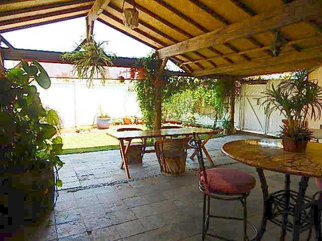4559 Rolfe Road San Diego, CA 92117 - Photo 15 of 25 Another angle of the patio; gate you see on the right would take you to the gated driveway and up the stairs you'd go to the granny flat/studio