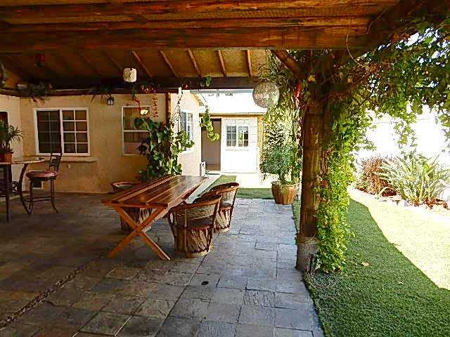 4559 Rolfe Road San Diego, CA 92117 - Photo 16 of 25 Patio and yard to the right; straight ahead you see an open door to the office/den/play room/ craft room - make it anything you want.