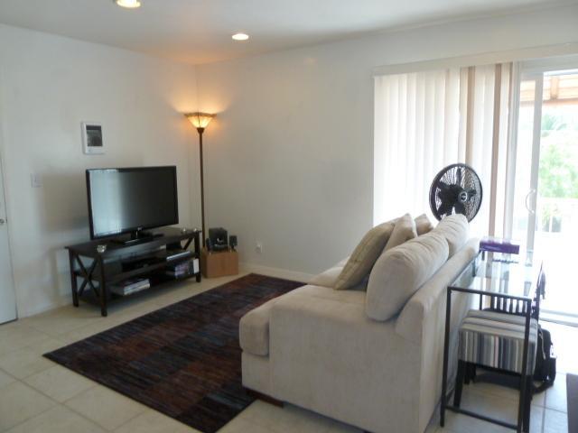 4559 Rolfe Road San Diego, CA 92117 - Photo 21 of 25 Studio/ Living room; sliding glass door to a large, appx 110 sq ft, balcony