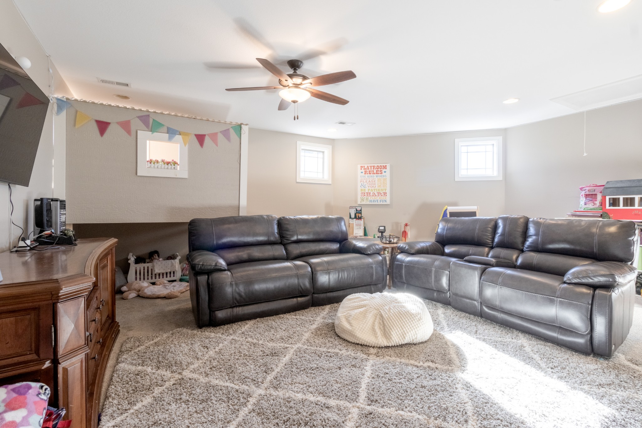 4570 Sango Road Clarksville, TN 37043 - Photo 28 of 32 a living room with furniture a large window and a flat screen tv