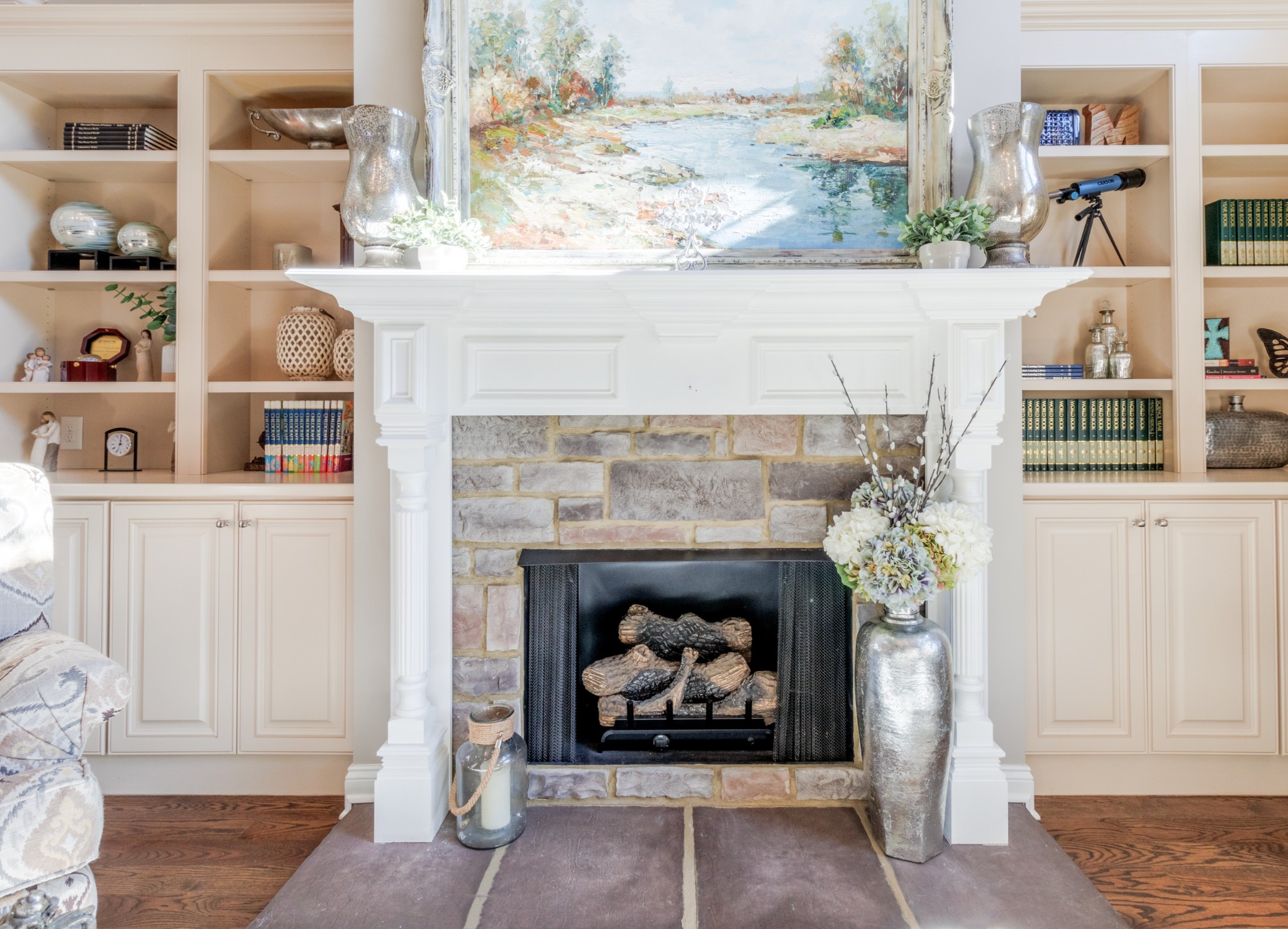 4570 Sango Road Clarksville, TN 37043 - Photo 8 of 32 a living room with a fireplace and a wooden floor