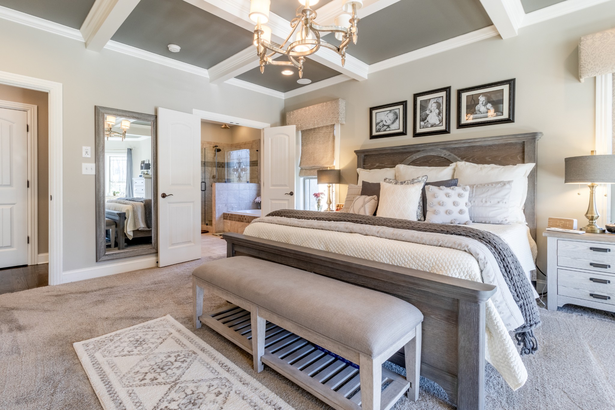 4570 Sango Road Clarksville, TN 37043 - Photo 10 of 32 a bedroom with a large bed and a chandelier