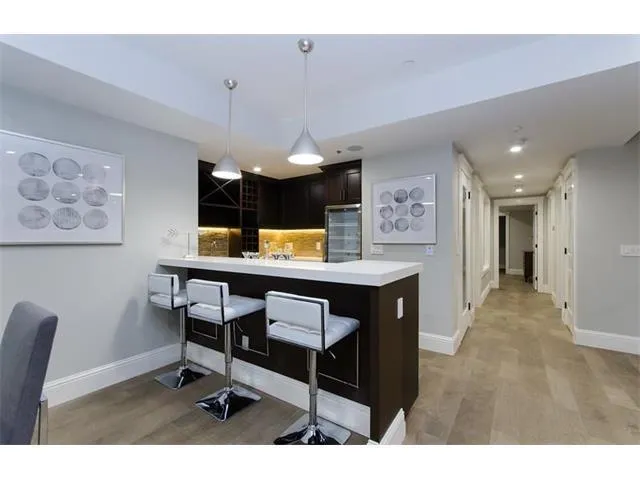 a view of a kitchen with a table and chairs