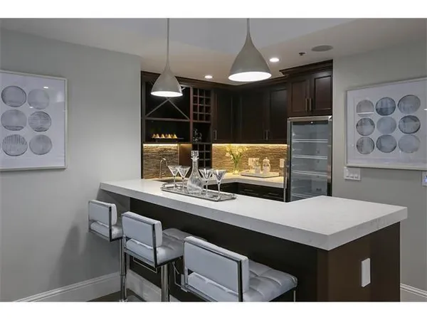 a kitchen with a sink cabinets and window