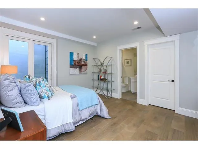 a bedroom with a bed and a table