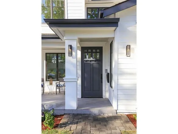 a view of a hallway with dining area and entryway