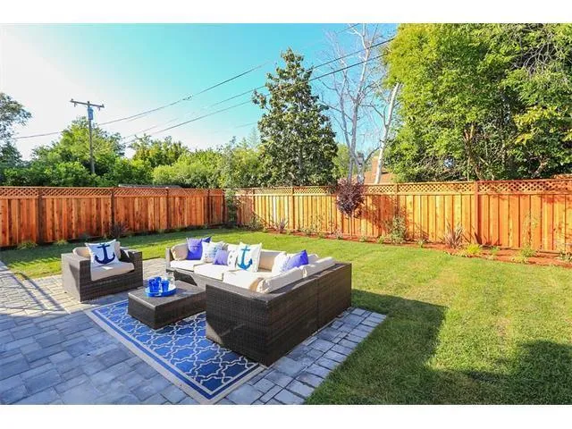 a view of a couches in patio and a yard