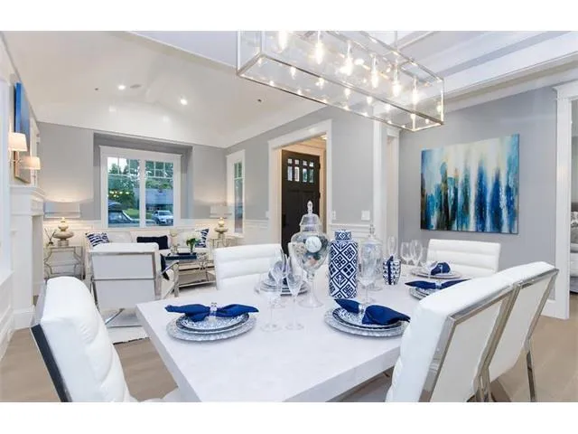 a kitchen with furniture and a chandelier
