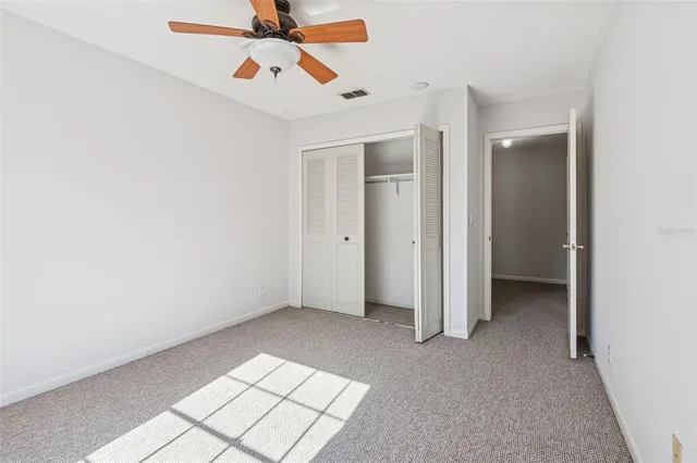 an empty room with fan