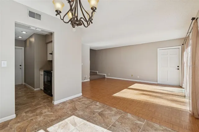 a view of a livingroom with wooden floor and closet area