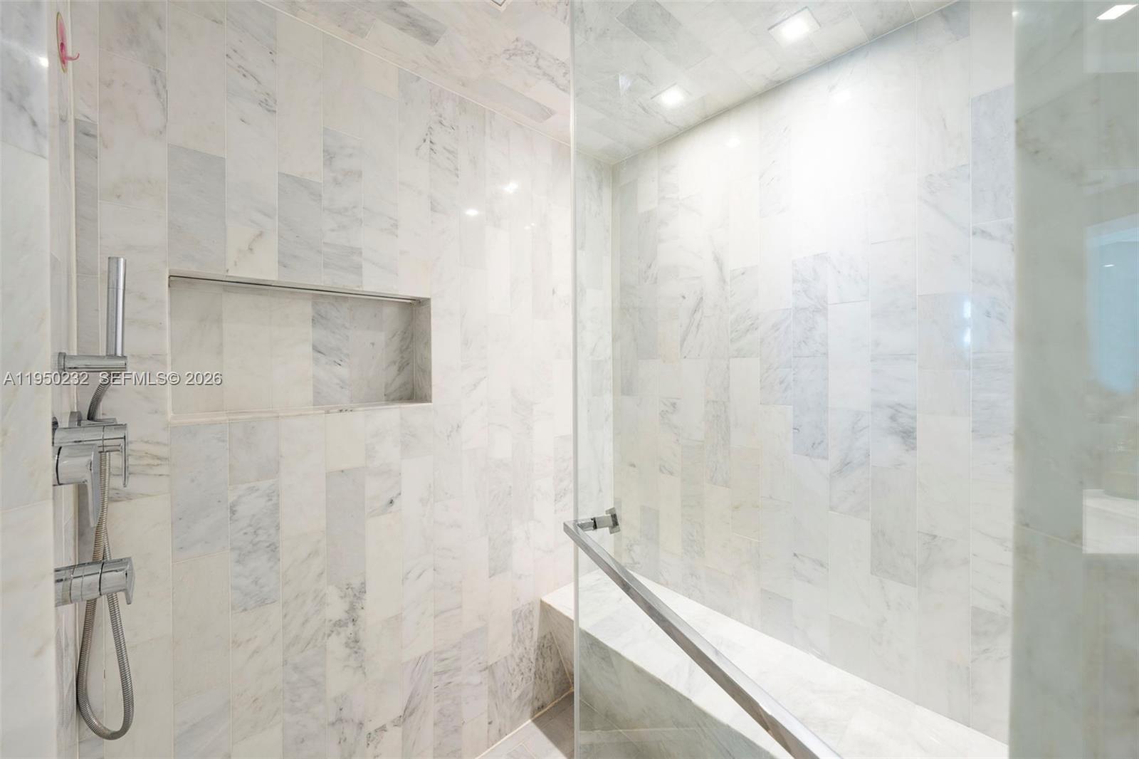 1000 South Pointe Drive, Unit 2802 Miami Beach, FL 33139 - Photo 21 of 44 a bathroom with a shower