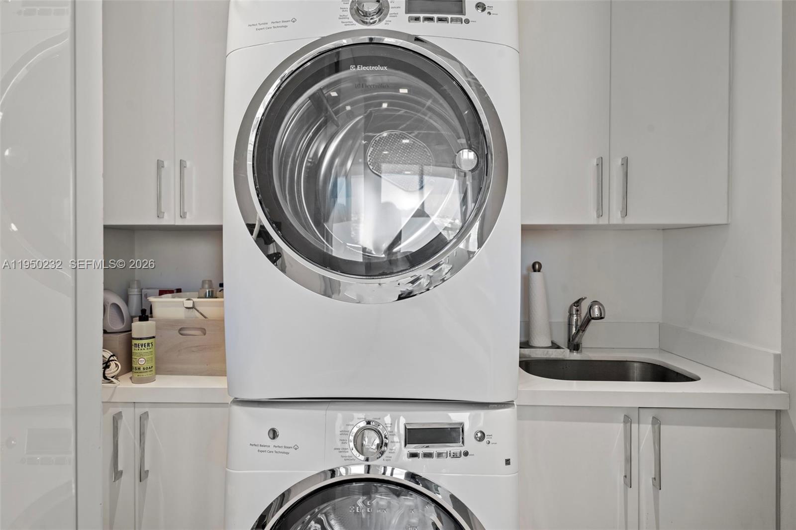 1000 South Pointe Drive, Unit 2802 Miami Beach, FL 33139 - Photo 33 of 44 a utility room with sink dryer and washer
