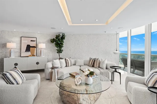 a living room with furniture and a table