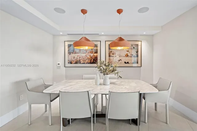 a view of a dining room with furniture and window