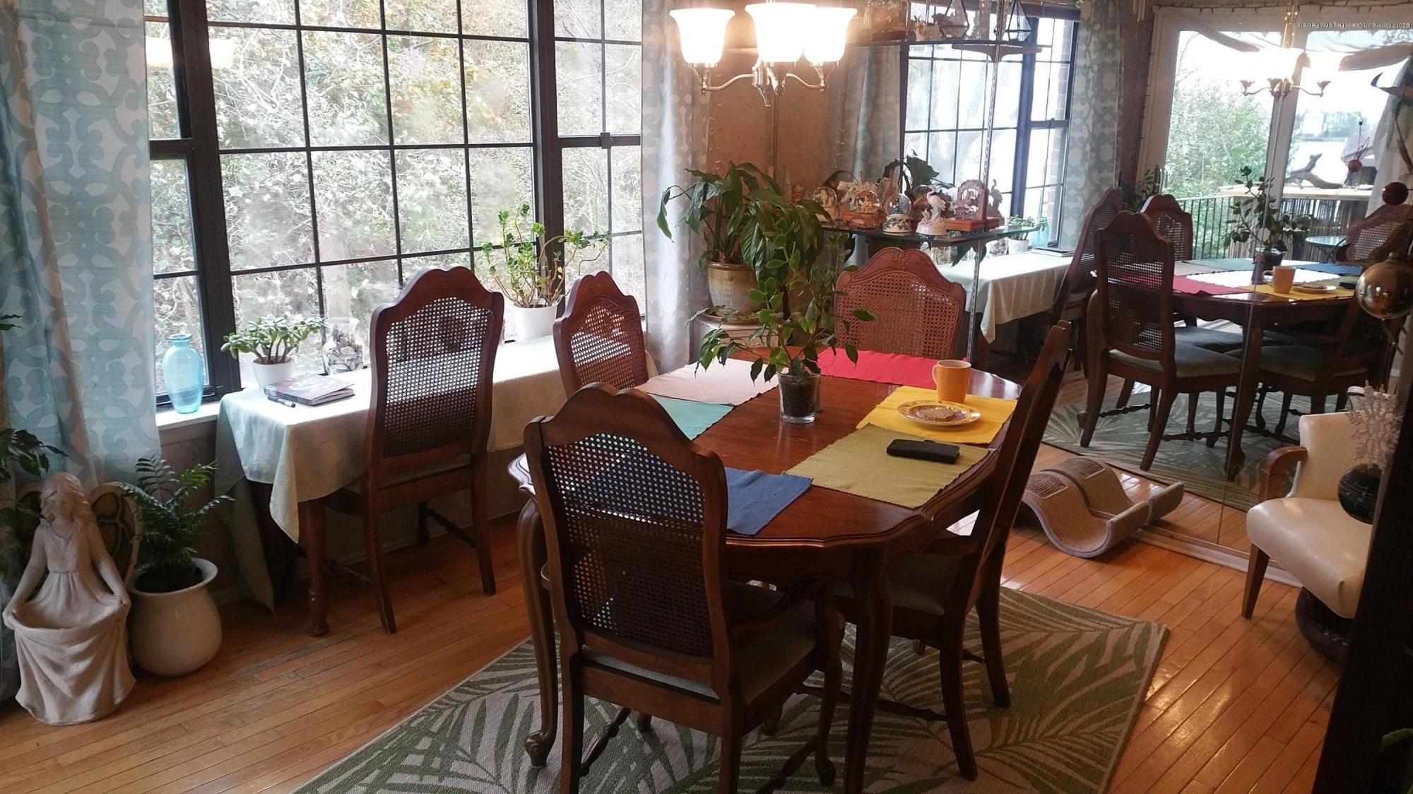 200 Portland Road, Unit C6 Highlands, NJ 07732 - Photo 8 of 19 a view of a dining room with furniture window and wooden floor