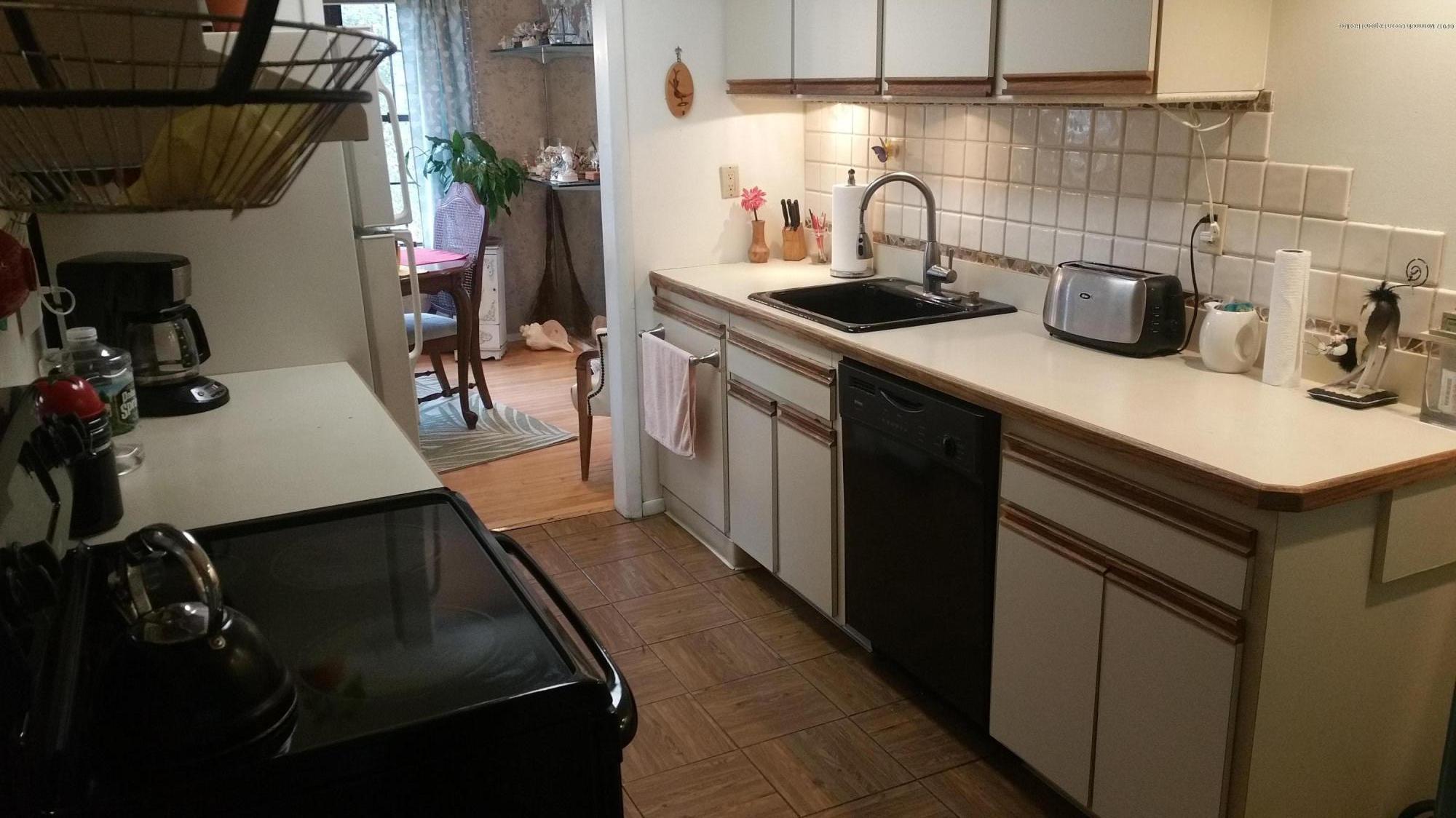 200 Portland Road, Unit C6 Highlands, NJ 07732 - Photo 9 of 19 a kitchen with a sink appliances and cabinets