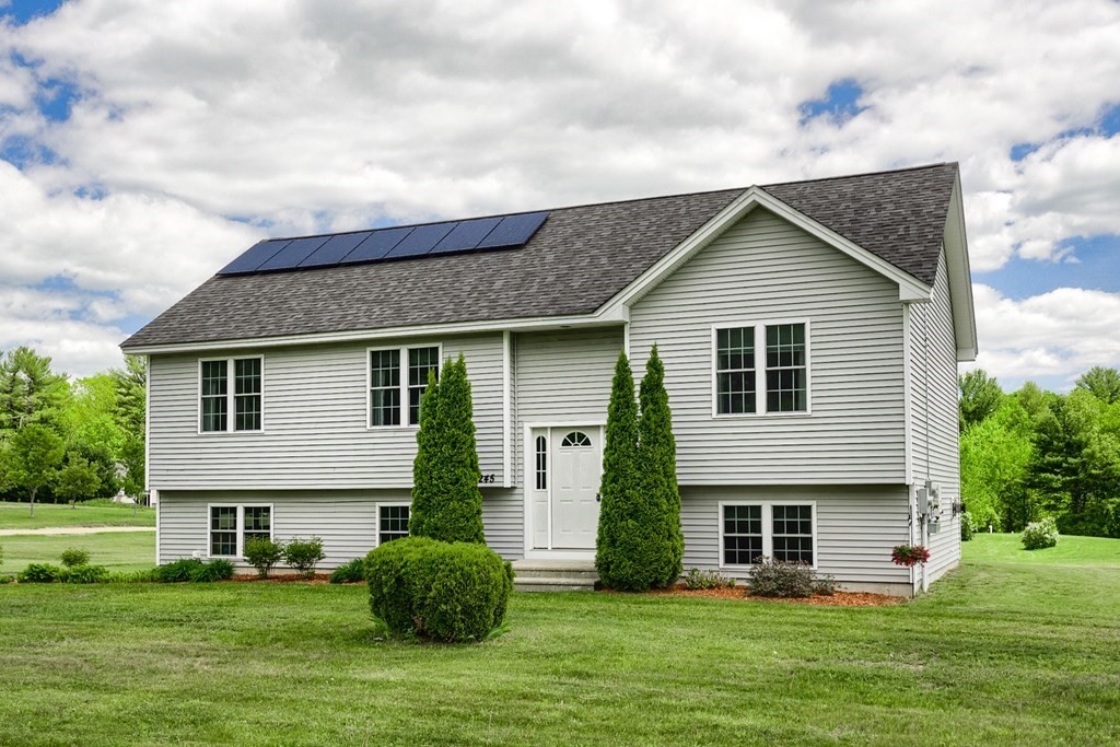 245 Pleasantdale Road Rutland, MA 01543 - Photo 1 of 24 a front view of a house with a garden