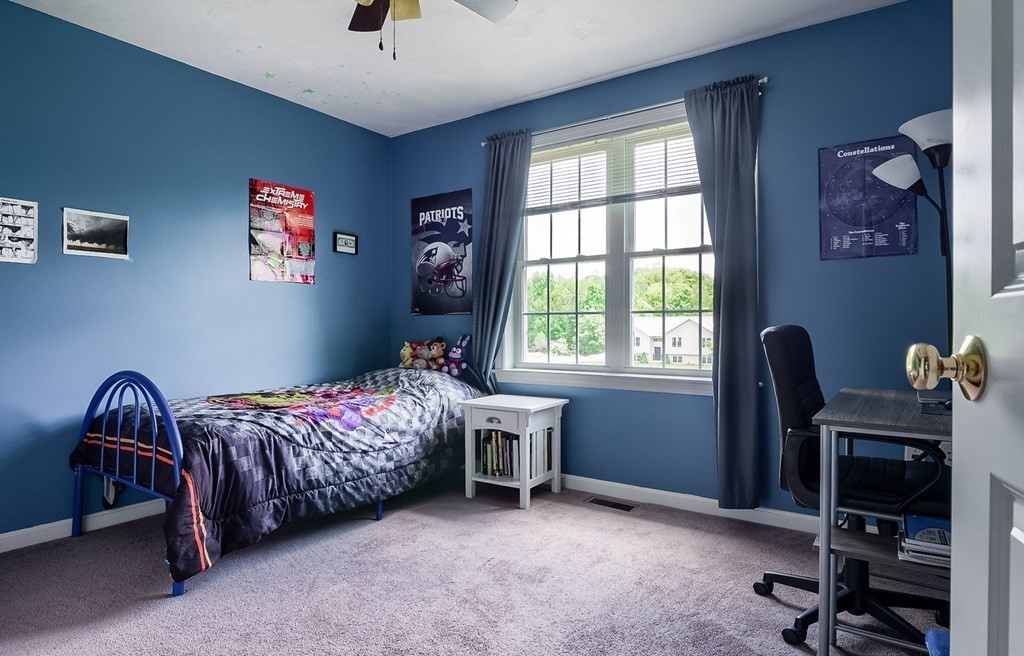245 Pleasantdale Road Rutland, MA 01543 - Photo 11 of 24 a bedroom with a bed and a window