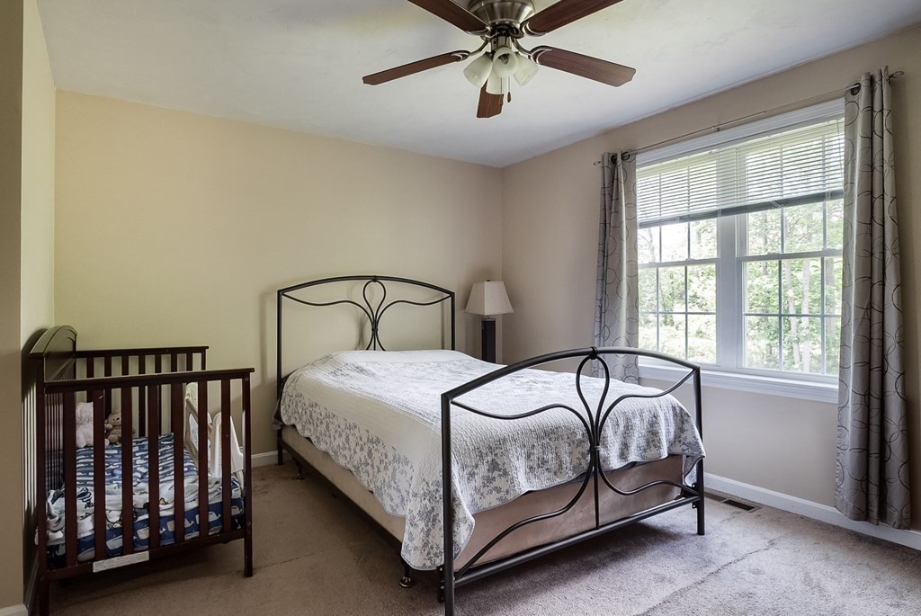 245 Pleasantdale Road Rutland, MA 01543 - Photo 13 of 24 a bedroom with a bed and window