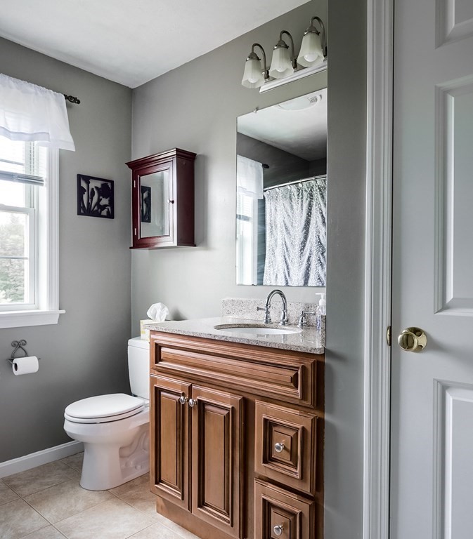 245 Pleasantdale Road Rutland, MA 01543 - Photo 15 of 24 a bathroom with a toilet sink and mirror