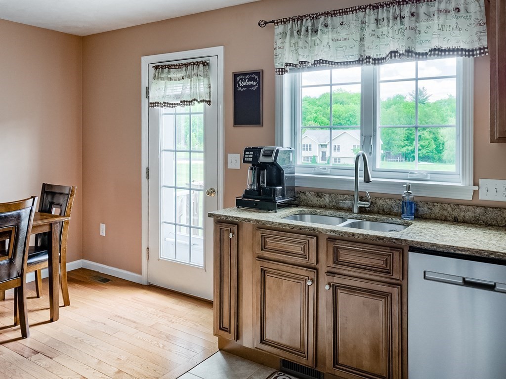 245 Pleasantdale Road Rutland, MA 01543 - Photo 4 of 24 a kitchen with stainless steel appliances granite countertop a stove a sink and a refrigerator