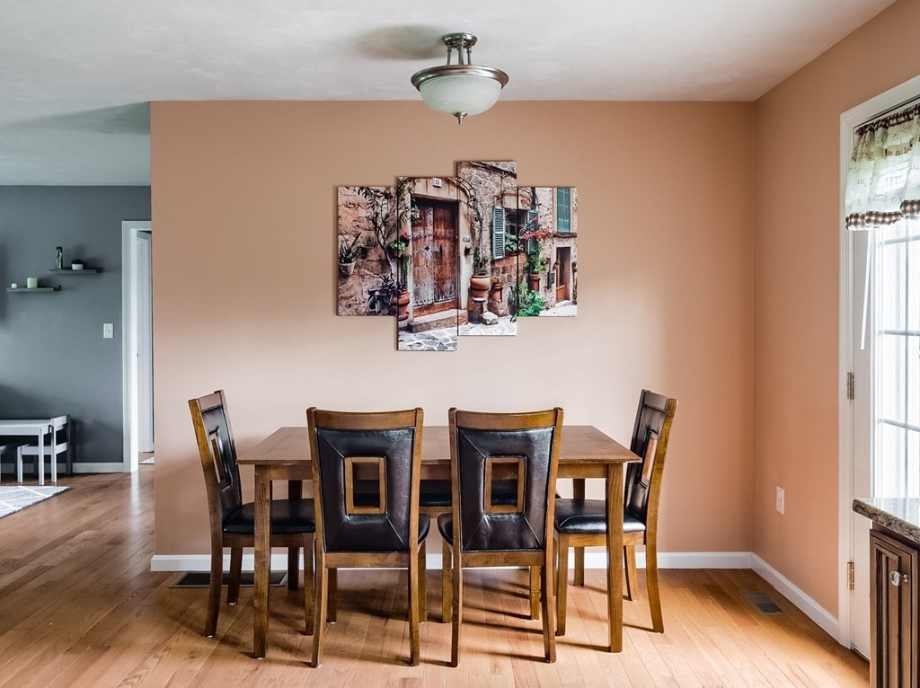 245 Pleasantdale Road Rutland, MA 01543 - Photo 5 of 24 a view of a dining room with furniture and chandelier