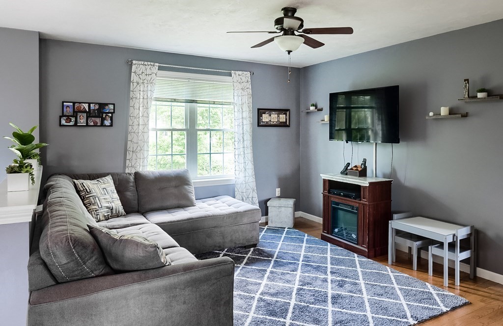 245 Pleasantdale Road Rutland, MA 01543 - Photo 9 of 24 a living room with furniture a flat screen tv and a window