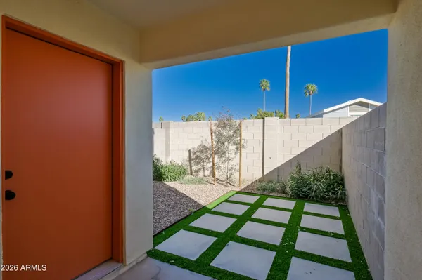 swimming pool view with a seating space