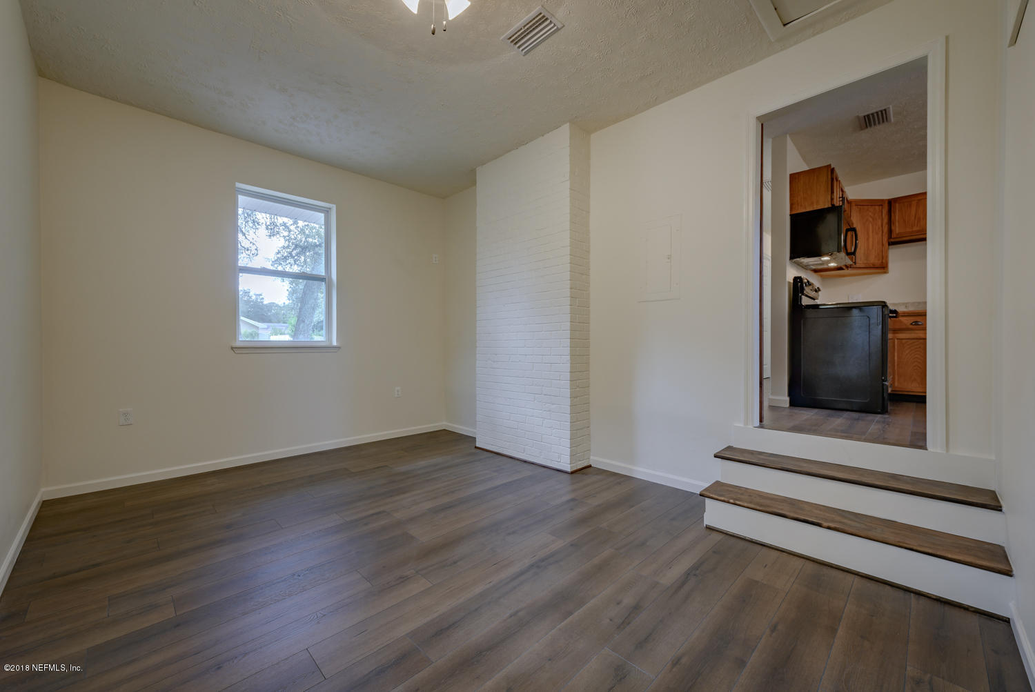 117 Tanager Road St. Augustine, FL 32086 - Photo 12 of 30 an empty room with wooden floor closet and windows