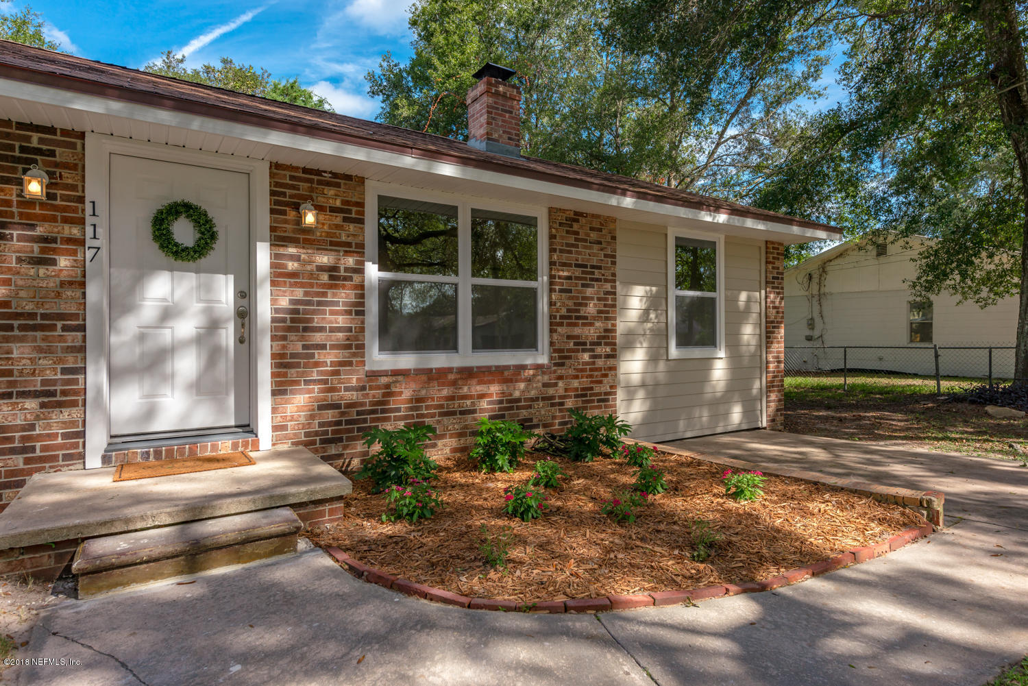 117 Tanager Road St. Augustine, FL 32086 - Photo 2 of 30 a front view of a house with a yard